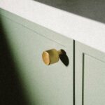 plank-hardware-cabinetry-lennon-grooved-button-knob-brass-29997610631266